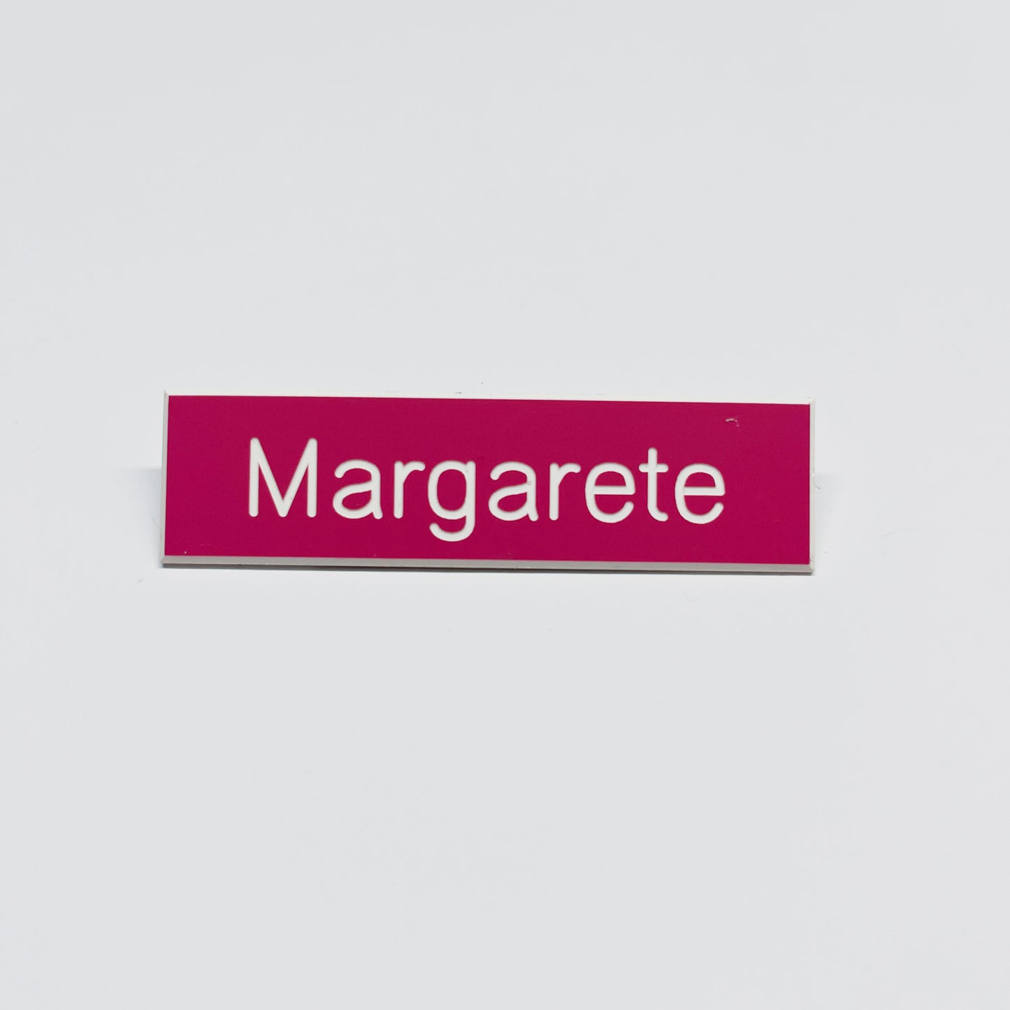 Julia Scher: Guard Name Tag, 2018